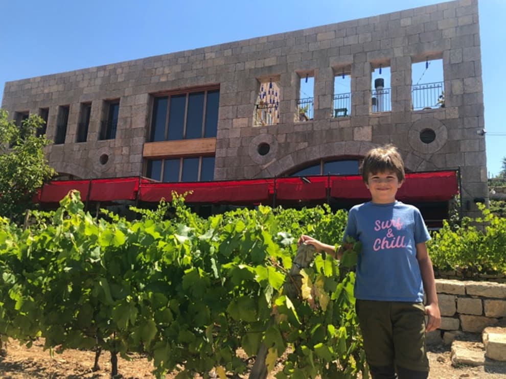 Michel Jr, Sami’s eldest son, in front of the Faqra restaurant and winery.